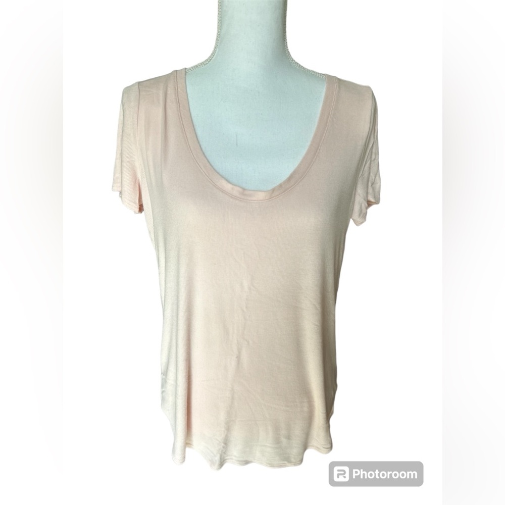 Pale pink Athleta ribbed short sleeve t-shirt with deep scoop front neckline.